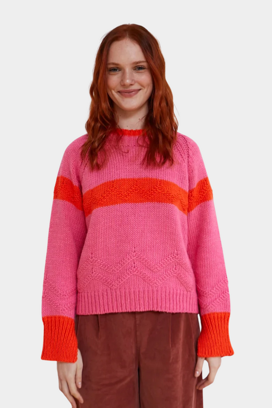 Jersey Caramelo de Dr Bloom para mujer en rosa con franjas naranja, cuello redondo y punto grueso