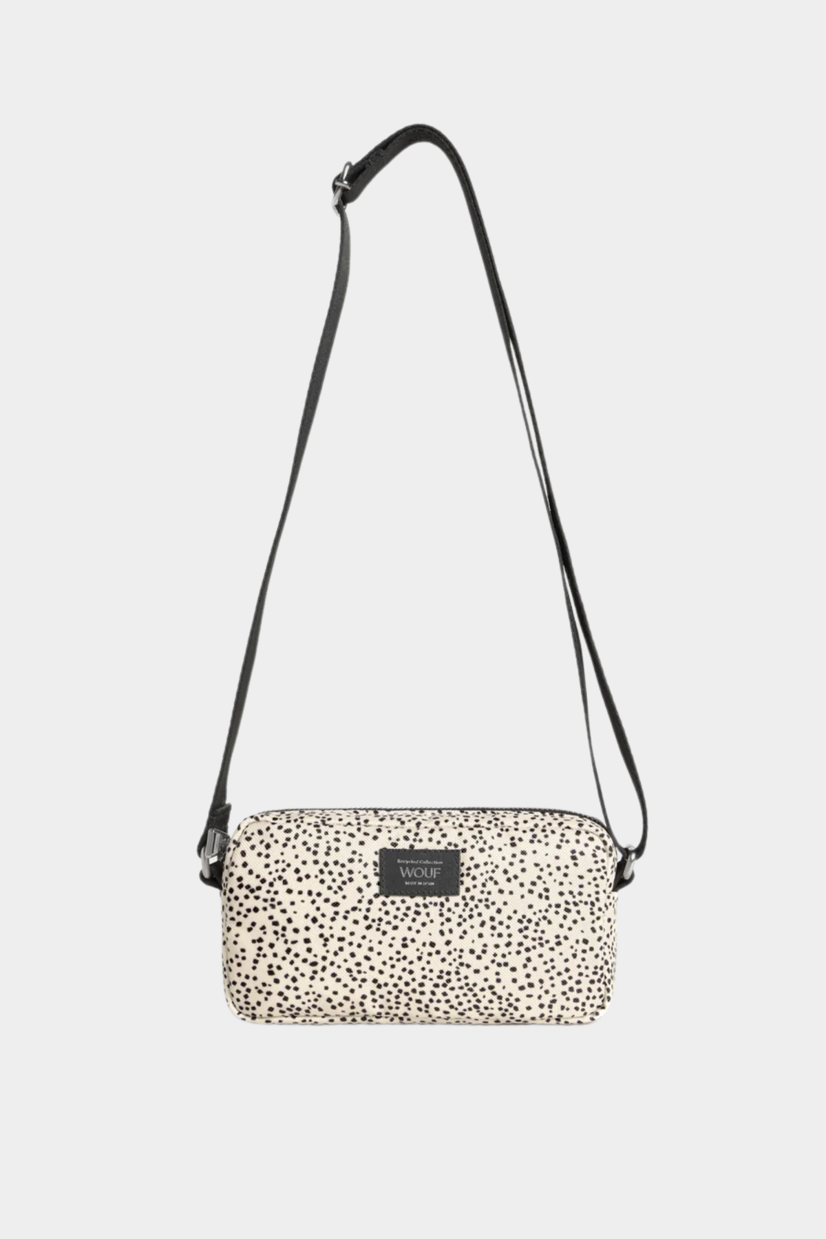 Mini bolso bandolera Wouf Panna en beige y negro, con microestampado, correa ajustable y cierre de cremallera