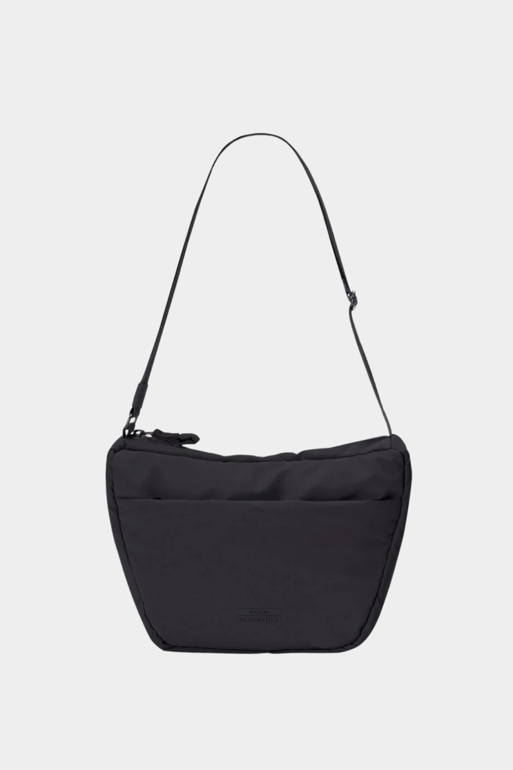 Bolso Ucon Acrobatics Adam Half-Moon Mini negro acolchado, con correa ajustable y diseño compacto de 5 litros