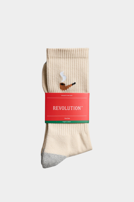Detalle de los calcetines Revolution Pip Offwhite con bordado lateral, talón gris y tejido de algodón orgánico