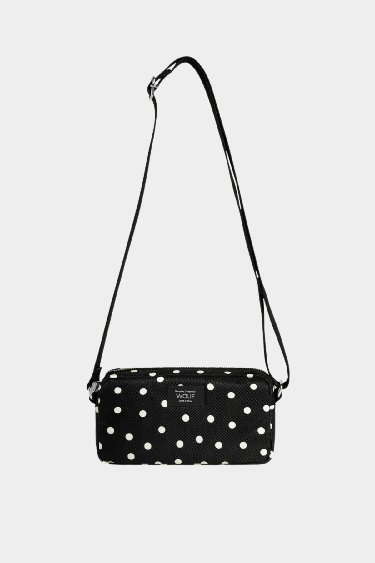 Mini bolso bandolera Wouf Grace negro con lunares blancos, correa ajustable y cierre de cremallera YKK