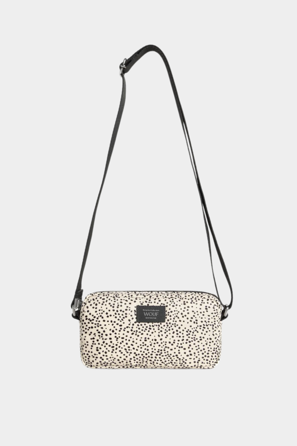 Mini bolso bandolera Wouf Panna en beige y negro, con microestampado, correa ajustable y cierre de cremallera